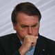 File photo showing President of Brazil Jair Bolsonaro coughing at Planalto Palace on December 9, 2020.